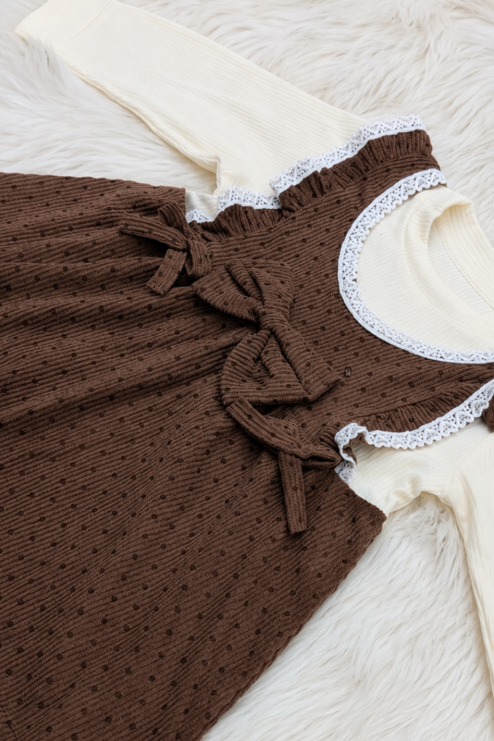 Close-up of chocolate brown and white polka dot premium cotton interlock fabric used in Featherhead Girls Polka Dot Frock FG-5639