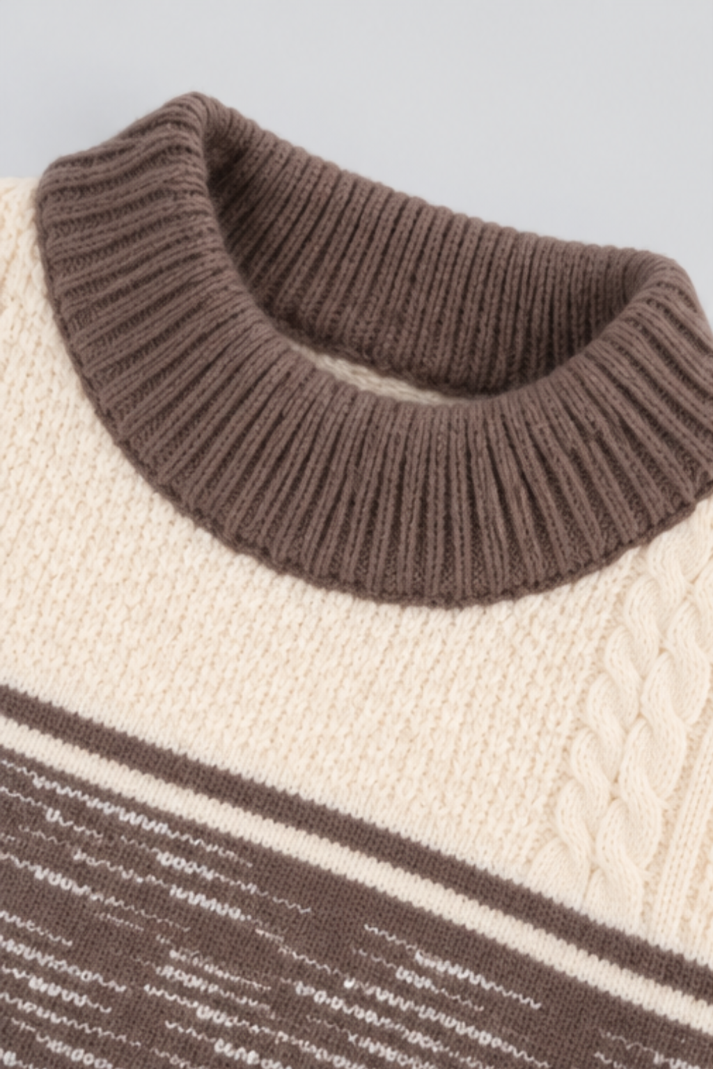 Close-up of chocolate brown ribbed round neckline and cream textured knit fabric on boys sweater FB-4286