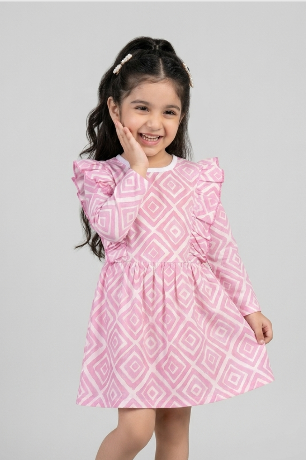 Girls pink geometric print cotton dress by Featherhead Baby