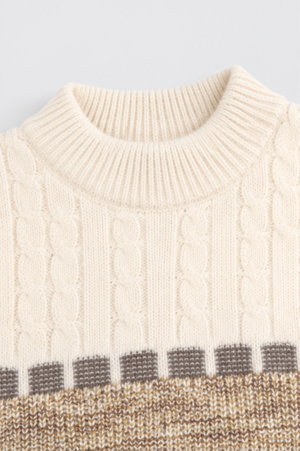 Close-up of cream ribbed round neckline and cable knit detailing on Featherhead kids winter sweater FB-4291
