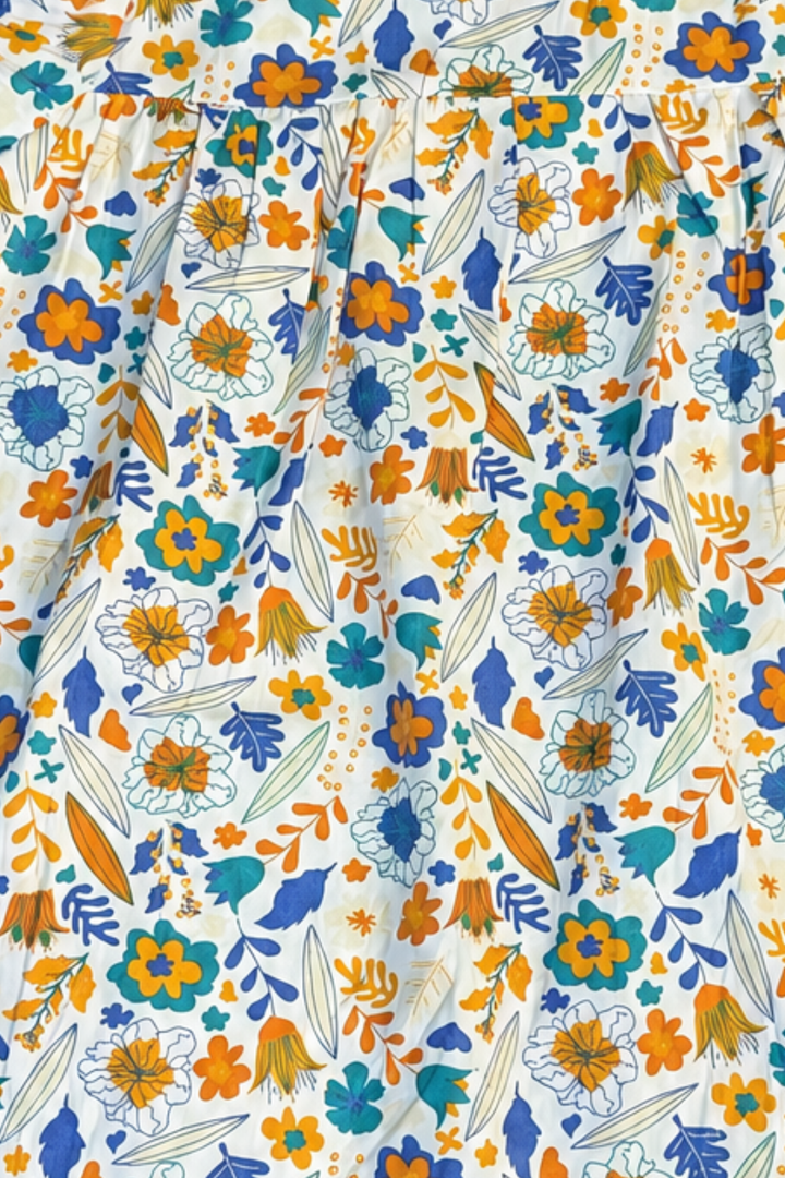 Close-up of blue and yellow floral cotton fabric used in Featherhead Girls Puff Sleeves Dress FB-5587