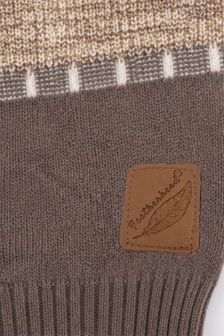 Featherhead signature brown logo patch on mocha brown ribbed hem of kids cable knit sweater FB-4291