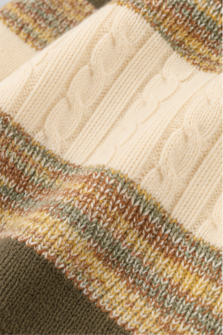 Close-up of textured cream cable knit fabric with olive brown and earthy green stripes on sweater FB-4281