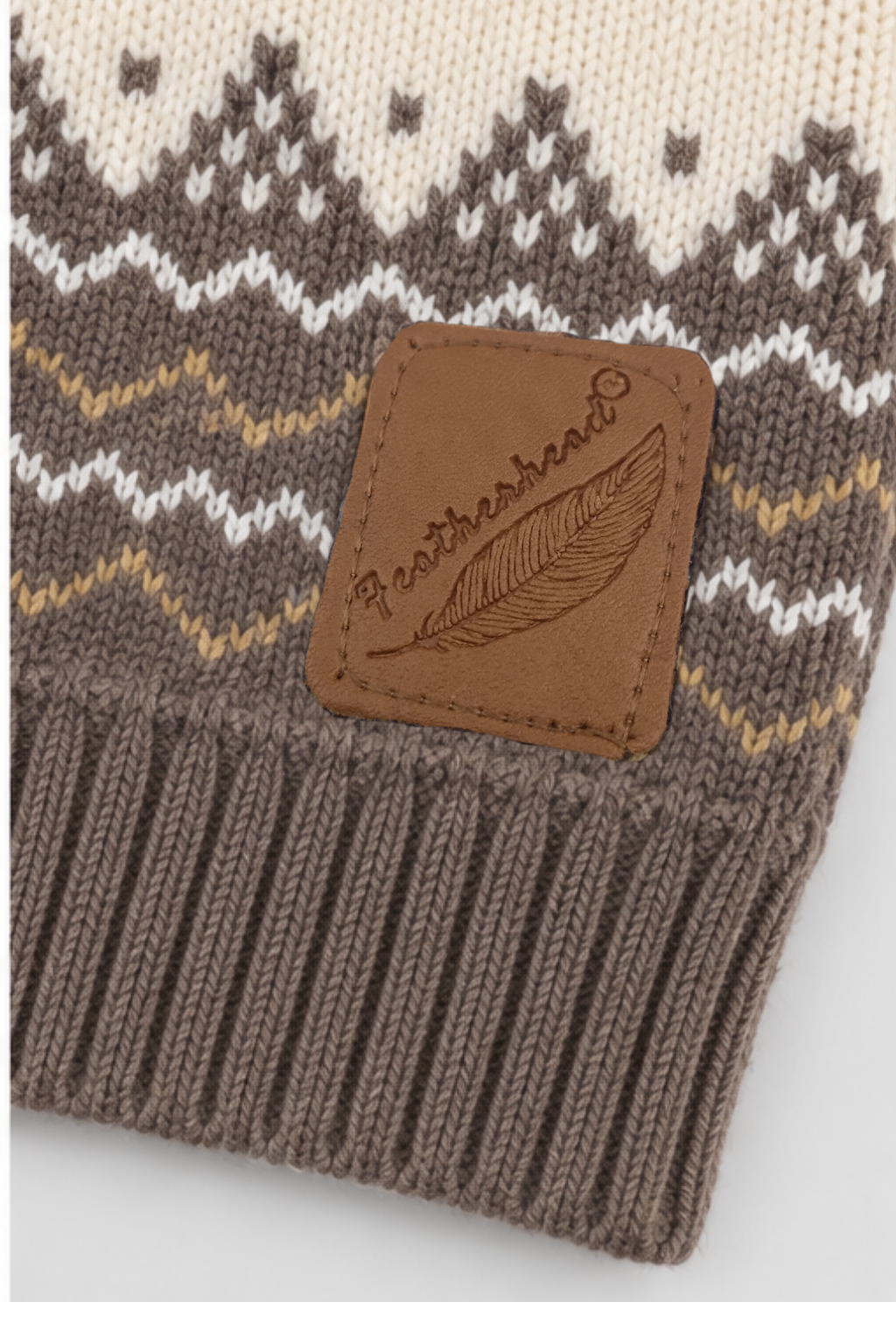 Featherhead brown logo patch on ribbed hem of mocha brown Nordic knit sweater FB-4247