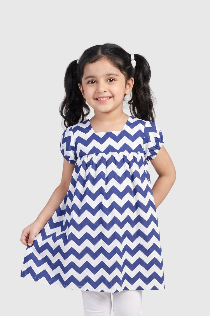Little girl wearing Featherhead Girls Cotton Chevron Puff Sleeves Dress FB-5581 in blue and white zigzag print