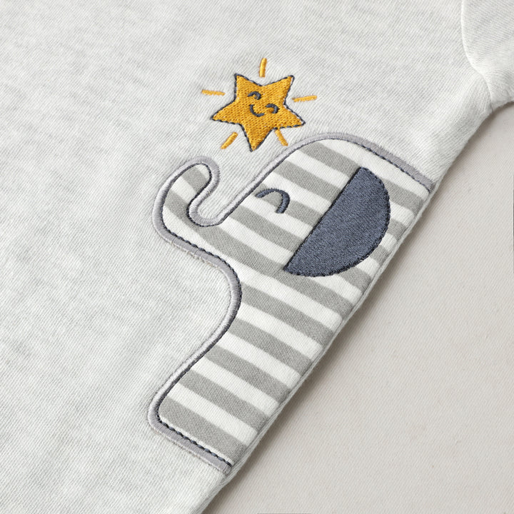 Close-up of Featherhead Bodysuit FN-2085 elephant embroidery design on soft grey cotton fabric.