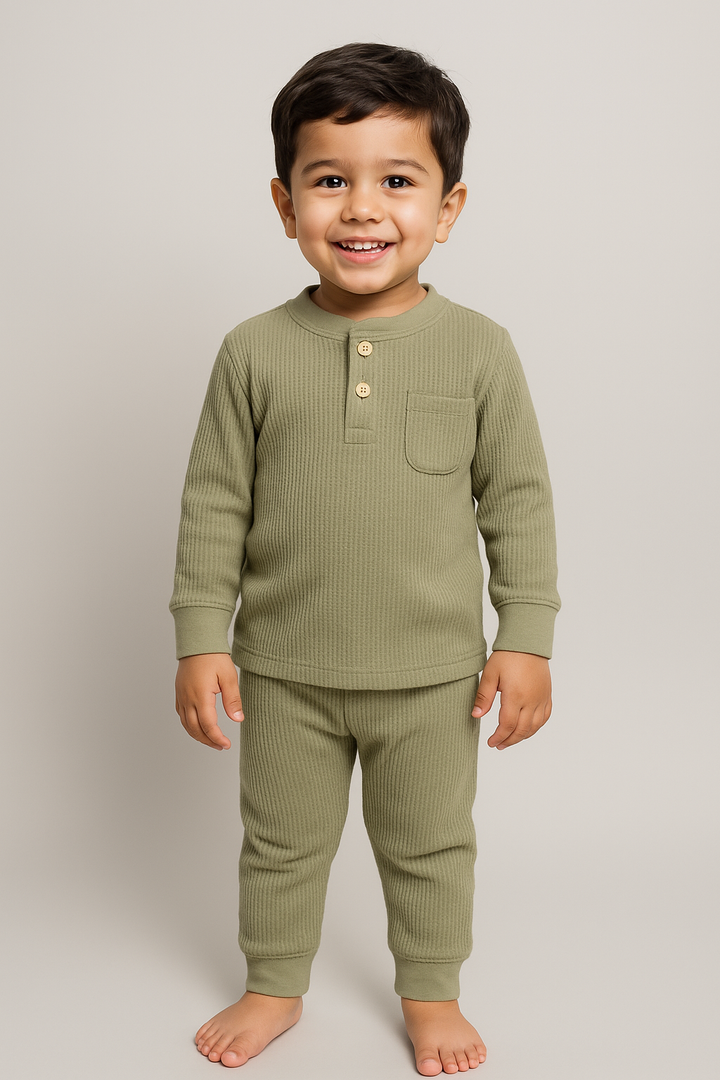 Baby wearing Featherhead FN-6513 cotton waffle thermal top and bottom set in sea grass color.