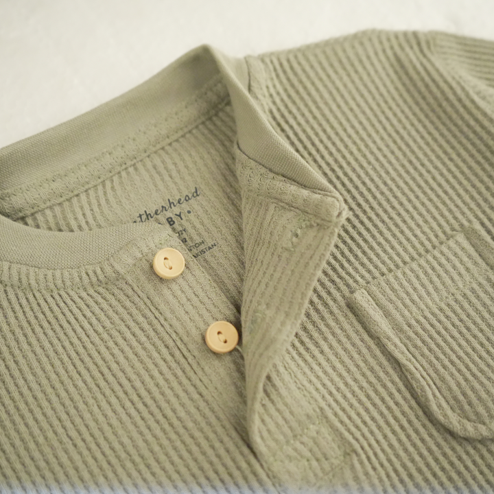 Detailed view of Featherhead FN-6513 waffle thermal fabric and stitching in sea grass color.