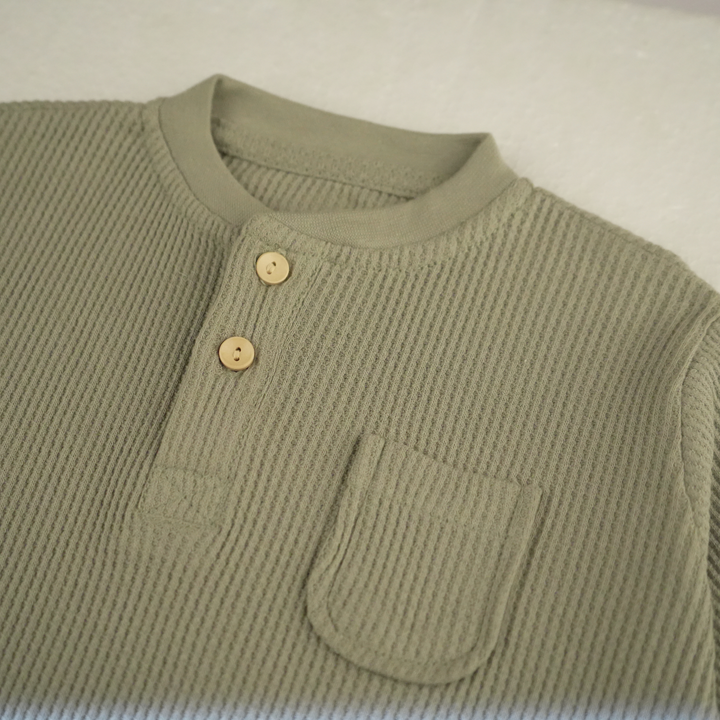 Close-up of FN-6513 cotton waffle thermal shirt with buttons in sea grass color.