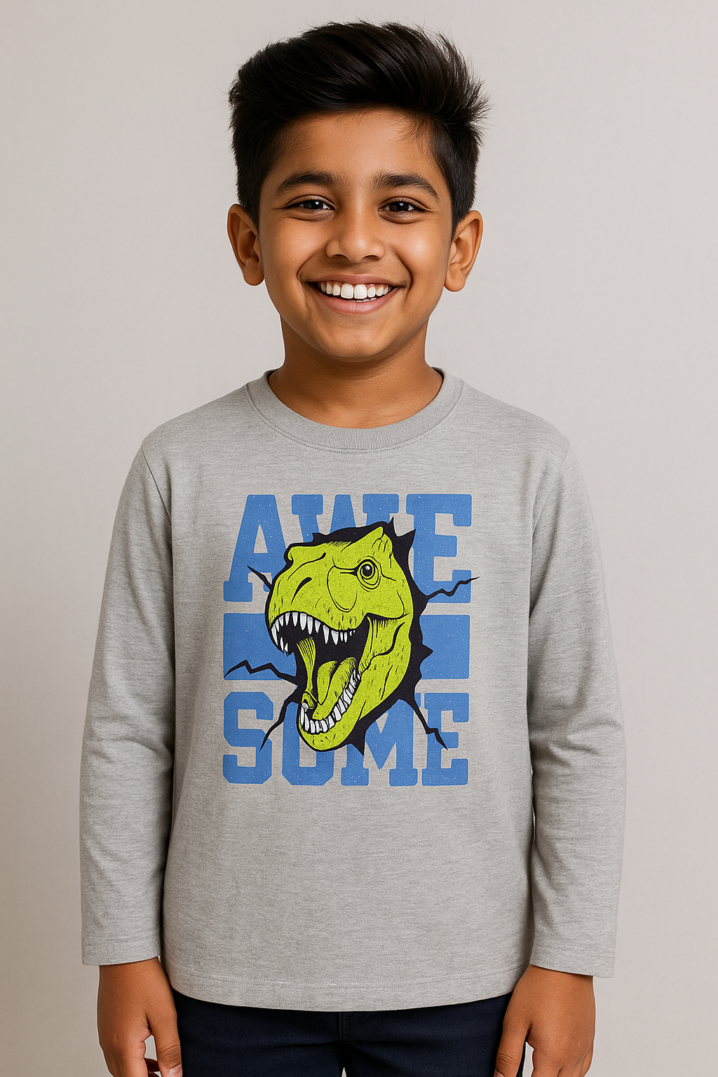 Boy wearing grey long-sleeve dinosaur graphic T-shirt