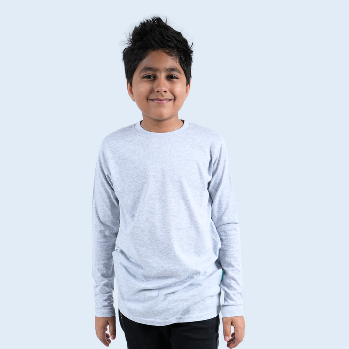 Boy wearing grey long sleeve T-shirt