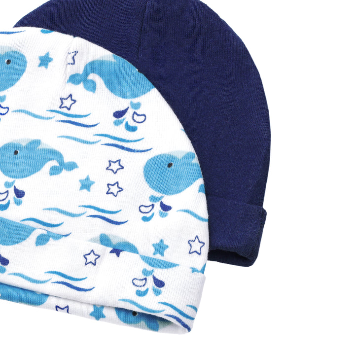 FS-483 side view of Blue Whale and Navy baby caps – Featherhead