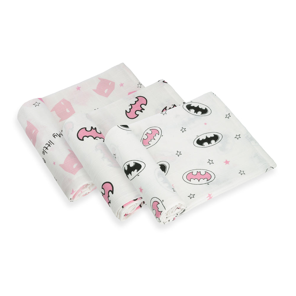 Flat lay of three swaddle blankets in coordinated Batman pink designs