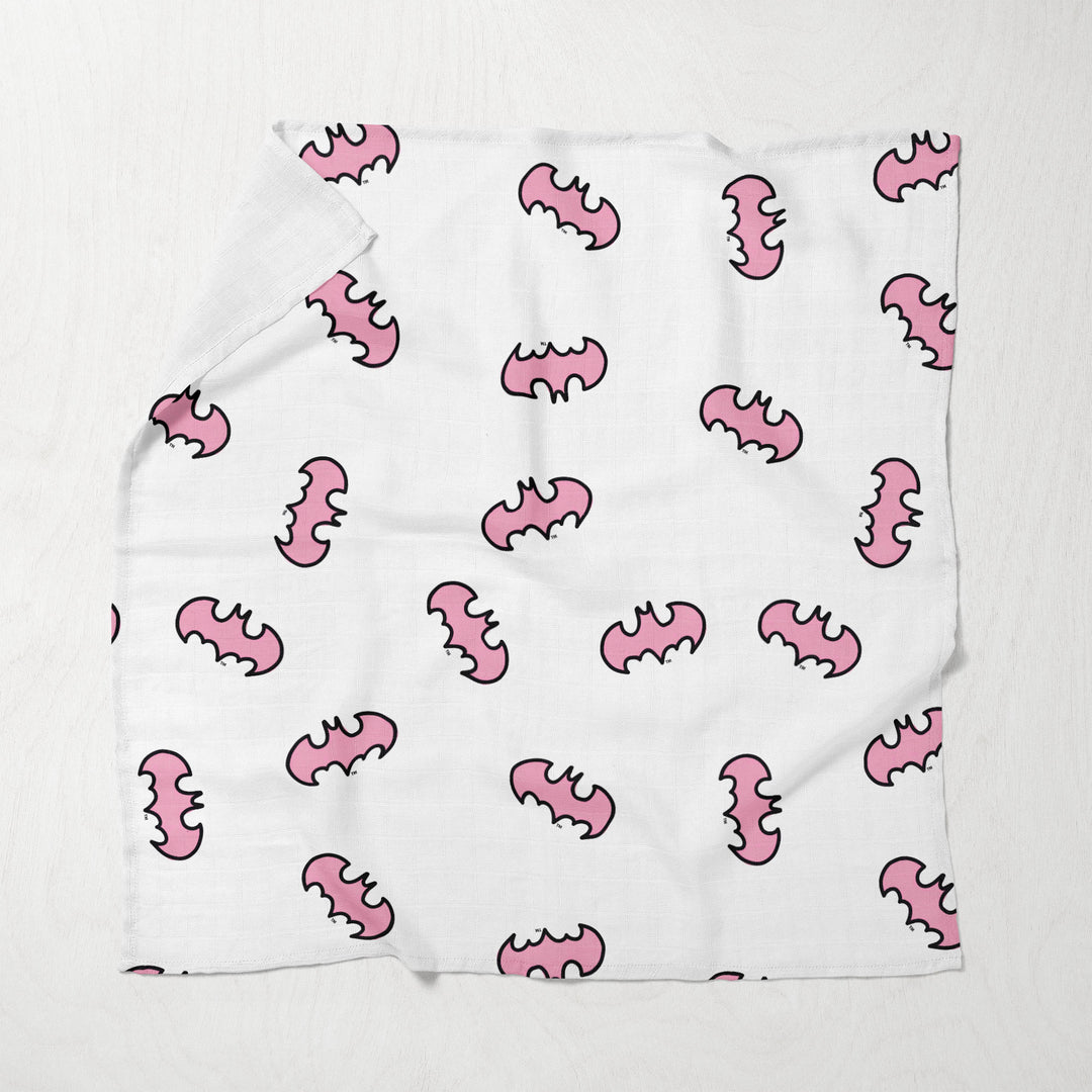 White muslin swaddle with pink character doodles and comic text prints