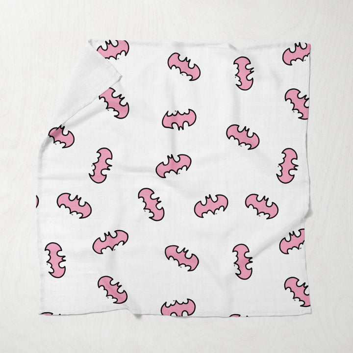 White muslin swaddle with pink character doodles and comic text prints