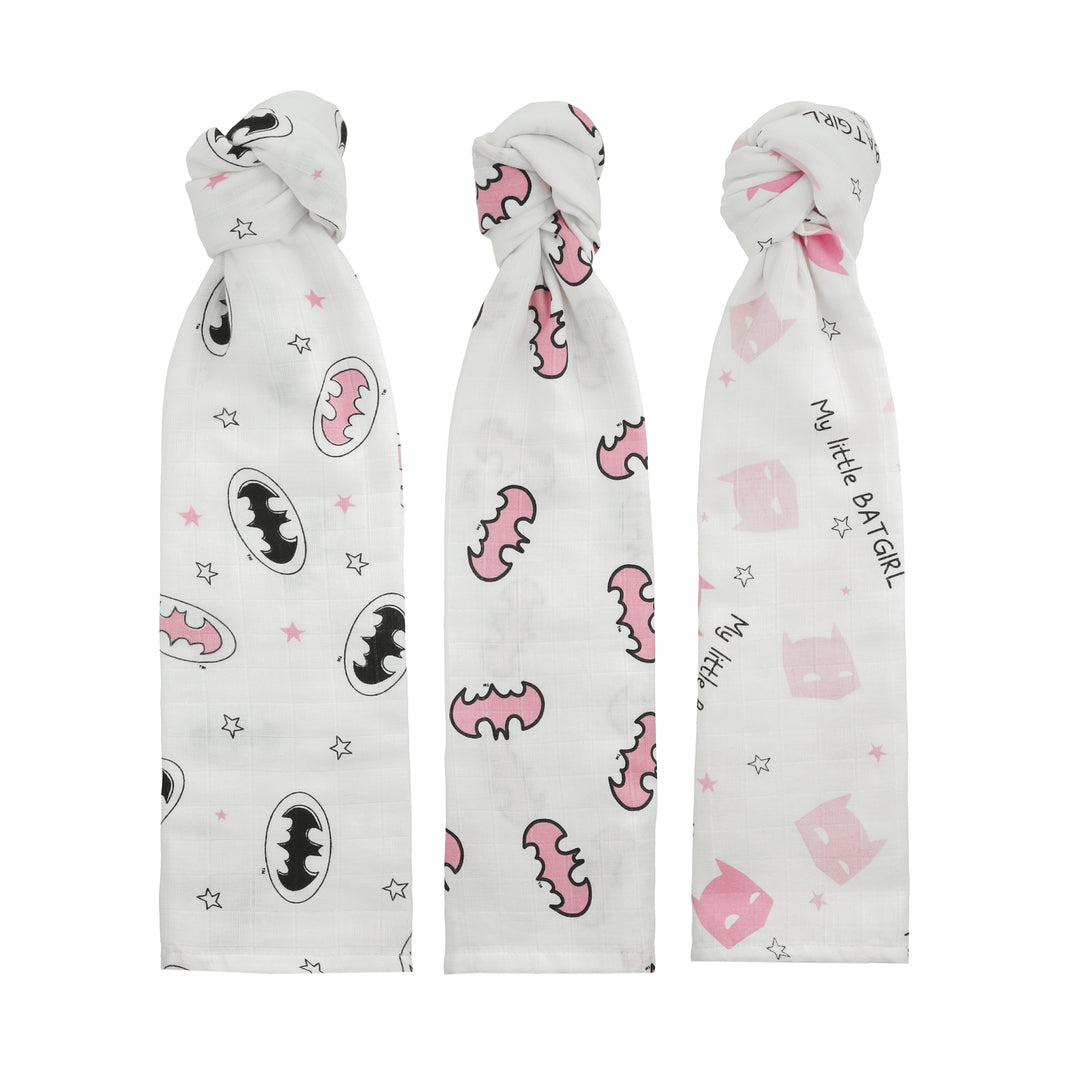 Swaddle blankets rolled and arranged vertically to show print designs