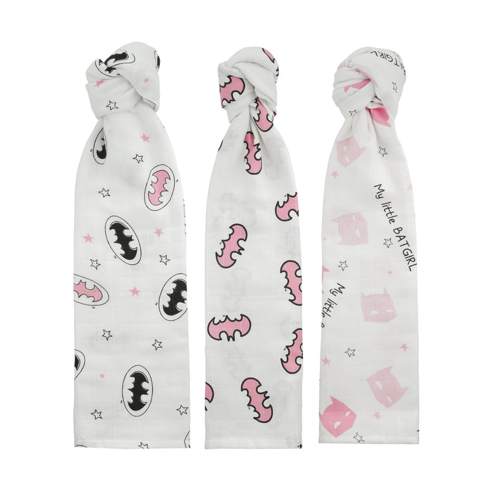Swaddle blankets rolled and arranged vertically to show print designs