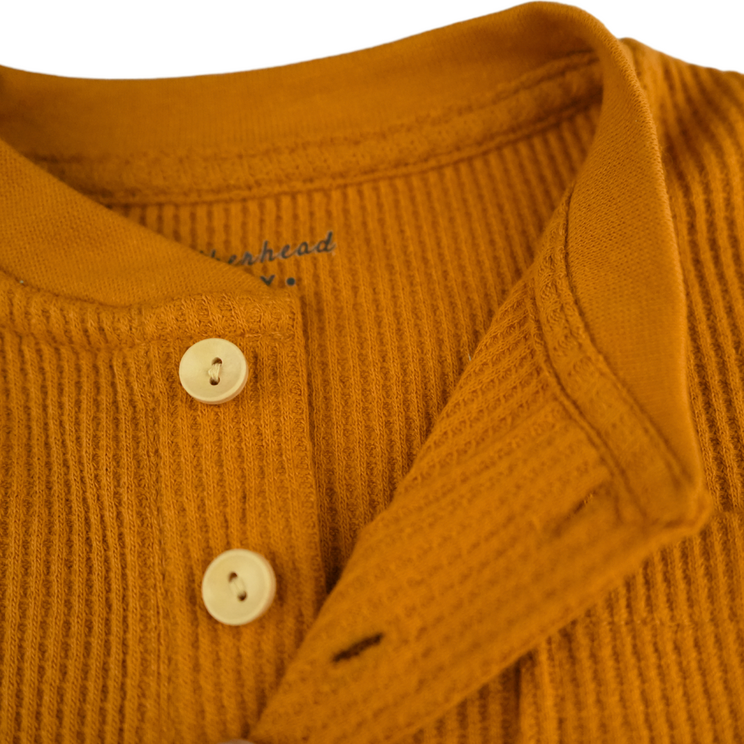 Detailed view of buttons and neckline on Honey Ginger Top FN-6507