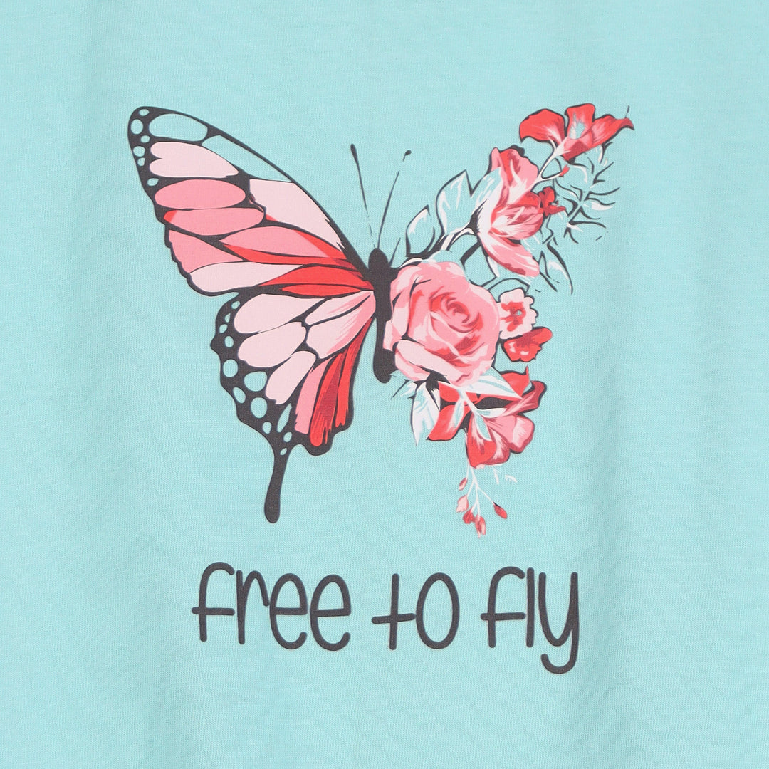 Close-up of butterfly and “Free to Fly” text