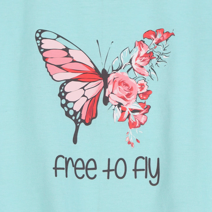 Close-up of butterfly and “Free to Fly” text