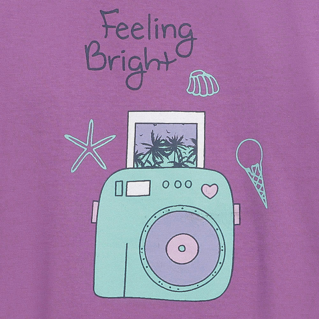 Close-up of camera print and “Feeling Bright” text