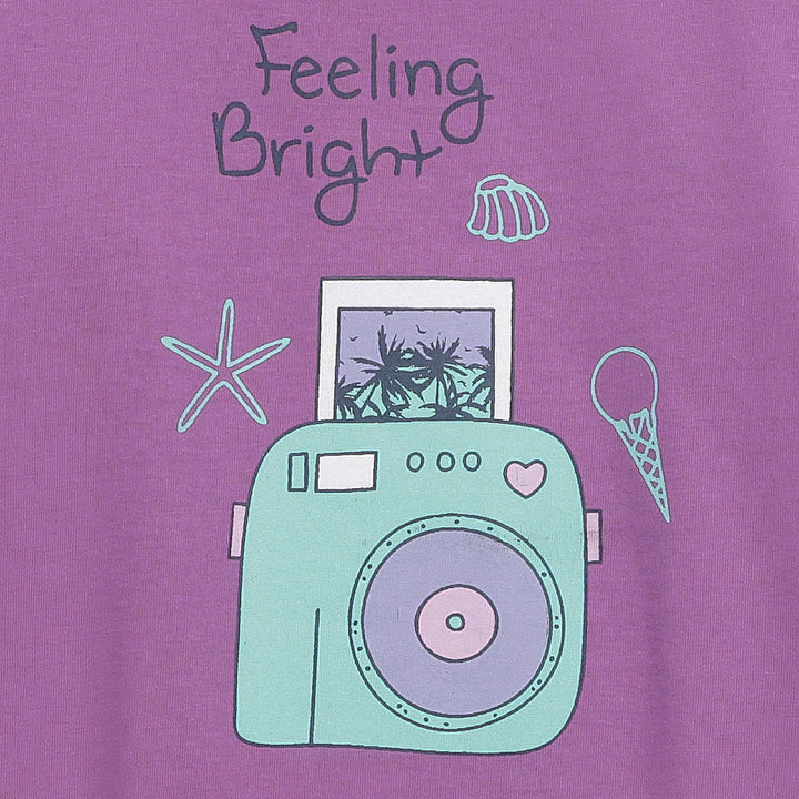 Close-up of camera print and “Feeling Bright” text
